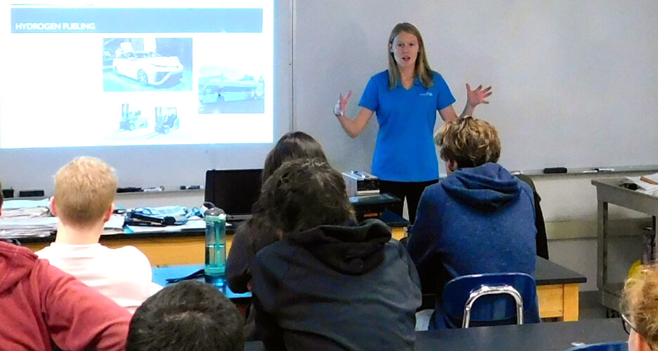 Photo of a PA Dream Team member presenting in front of a classroom of students